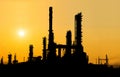 Oil refinery silhouette at sunset.