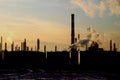 Oil refinery silhouetted Royalty Free Stock Photo