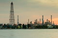 Oil refinery water front with sunrise sky background