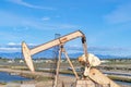 Oil rig against wetlands and sky at Bolsa Chica Ecological Reserve California Royalty Free Stock Photo