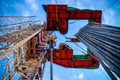 Oil rig derrick in oilfield against the bright blue sky. Drilling rig in oil field for drilled into subsurface in order