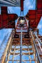 Oil rig derrick in oilfield against the bright blue sky. Drilling rig in oil field for drilled into subsurface in order Royalty Free Stock Photo