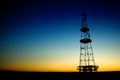 Oil rig silhouette over blue sky Royalty Free Stock Photo