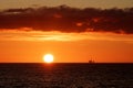 Oil rig at sunset in the north sea Royalty Free Stock Photo