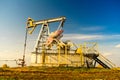 Working oil pump. Oil industry equipment. Oilfield. Royalty Free Stock Photo