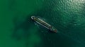 Oil Ship tanker or Liquid fied Petroleum Gas (LPG) sailing in green sea aerial top view Royalty Free Stock Photo