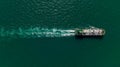 Oil Ship tanker or Liquid fied Petroleum Gas (LPG) sailing in green sea aerial top view Royalty Free Stock Photo