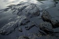 Oil sludge contaminating the sea during the oil spill disaster in Samet Island, Rayong, Thailand