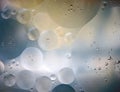 Oil spheres in the water, close-up macro shot. Royalty Free Stock Photo