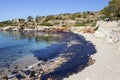 Oil spill. Environmental disaster. View of the polluted beach.