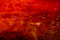 Abstract oil stain, oil spills on deep red