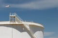 Oil storage tank with windsock Royalty Free Stock Photo