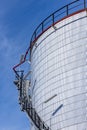 Oil storage tanks with blue sky background, Industrial tanks for petrol and oil, White fuel storage tank against blue sky Royalty Free Stock Photo