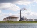 Oil storage tanks and exhaust stack of power station Hemweg in W Royalty Free Stock Photo