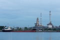 Oil tank ship over petrol refinery background Royalty Free Stock Photo