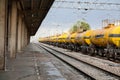 Oil tank truck train in a small train station Royalty Free Stock Photo