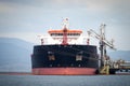 Oil tanker at a tank storage facility, Greece. Royalty Free Stock Photo