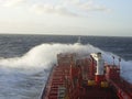 Oil tanker deck with pipeline in the stormy ocean