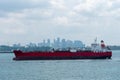 Oil tanker ship anchored in front of the Singapore downtown. Royalty Free Stock Photo