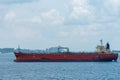 Oil tanker ship anchored in front of the Singapore downtown. Royalty Free Stock Photo