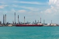 Oil tanker ship berthed at cargo terminal in port of Singapore.
