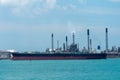 Oil tanker ship berthed at cargo terminal in port of Singapore.