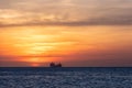 Oil tanker ship at sunset in the sea