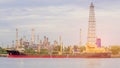 Oil transportation ship over refinery factory background Royalty Free Stock Photo