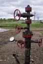 Oil valves and piping. production wellhead. A natural oil well. Horizontal view of a wellhead with valve armature. Oil and gas Royalty Free Stock Photo