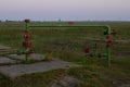 Oil valves and piping. production wellhead. A natural oil well. Horizontal view of a wellhead with valve armature. Oil and gas Royalty Free Stock Photo