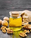 Oil walnut in jar on black board Royalty Free Stock Photo