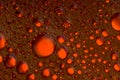 Oil and water dark red and orange bubbles and drops Royalty Free Stock Photo