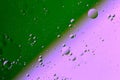 Oil on water flat colorful duotone macro abstract background photographic image.