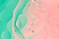 Oil on water macro photography abstract green and pink color gradient background Royalty Free Stock Photo