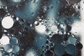 Oil with water round different sizes bubbles in blue and dark grey tones blur effect macro Royalty Free Stock Photo