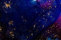 Oil on a water surface with bubbles and pieces of Gold leaf. Abstract colorful background. Close-up, not illustration Royalty Free Stock Photo