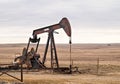 Oil Well Pump Jack pumping crude oil for fossil fuel energy in America Royalty Free Stock Photo