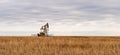 Oil Well Pump Jack pumping crude oil for fossil fuel energy in America Royalty Free Stock Photo