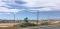 An oil well pumps crude out of the fields, California