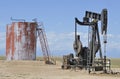 Oil well and storage tanks Royalty Free Stock Photo