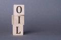 OIL word from wooden block words on gray background, in concept of economy, crisis and speculation Royalty Free Stock Photo