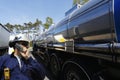 Oil worker and fuel trucking Royalty Free Stock Photo