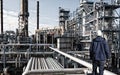 Oil worker and oil refinery industry Royalty Free Stock Photo