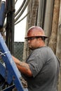 Oil Worker at Oil Well Abandoning Jobsite Royalty Free Stock Photo