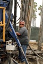 Oil Worker at Oil Well Abandoning Jobsite Royalty Free Stock Photo