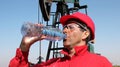 Oil Worker Taking Break And Drinking Fresh Water Royalty Free Stock Photo