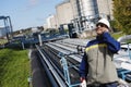 Oil worker talking in phone inside refinery Royalty Free Stock Photo