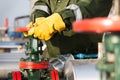 Oil worker turning valve Royalty Free Stock Photo