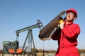 The Oilfield Worker At Well Pump Jack Site.