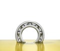 Oiling bearing. Bearing in oil isolated on a white background.